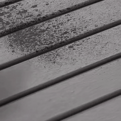 Water sprayed onto a slatted material sample in an absorption demonstration
